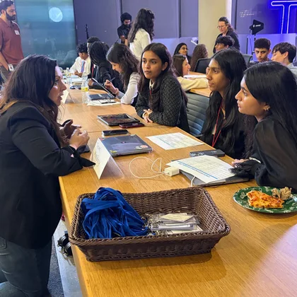 Students working along a long table at a SharkMakers workshop.